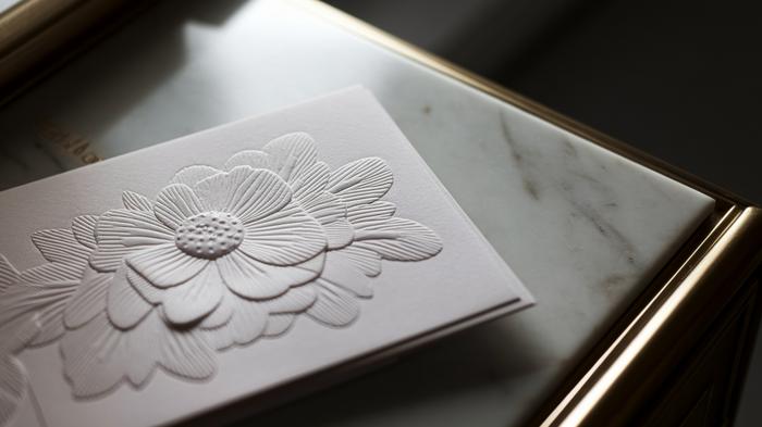 Close-up of embossed flower on greeting card