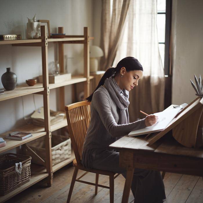 Woman peacefully drawing