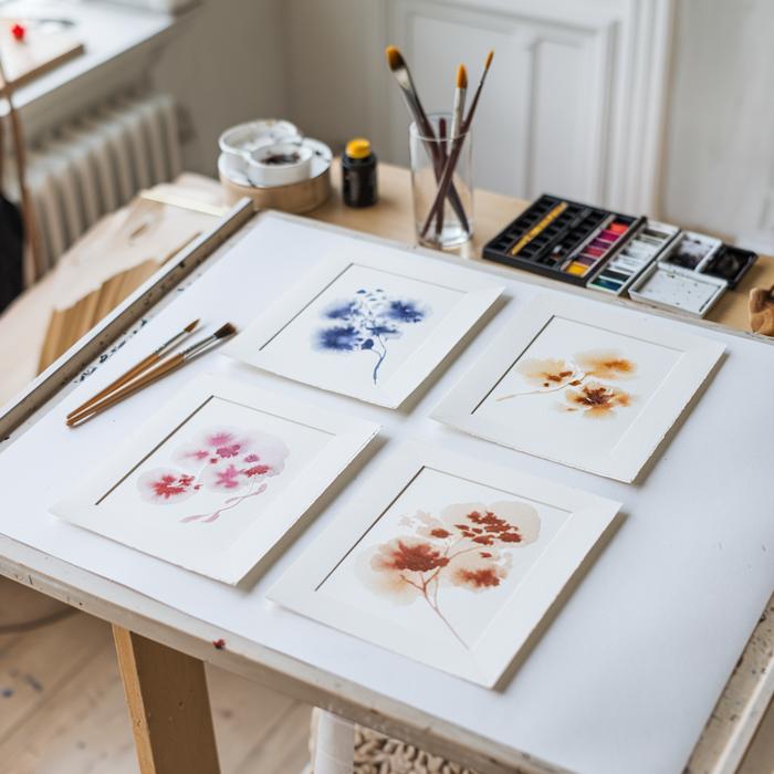 Four watercolor paintings showing different techniques by mature artist