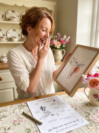 Her hummingbird, framed above the reading chair