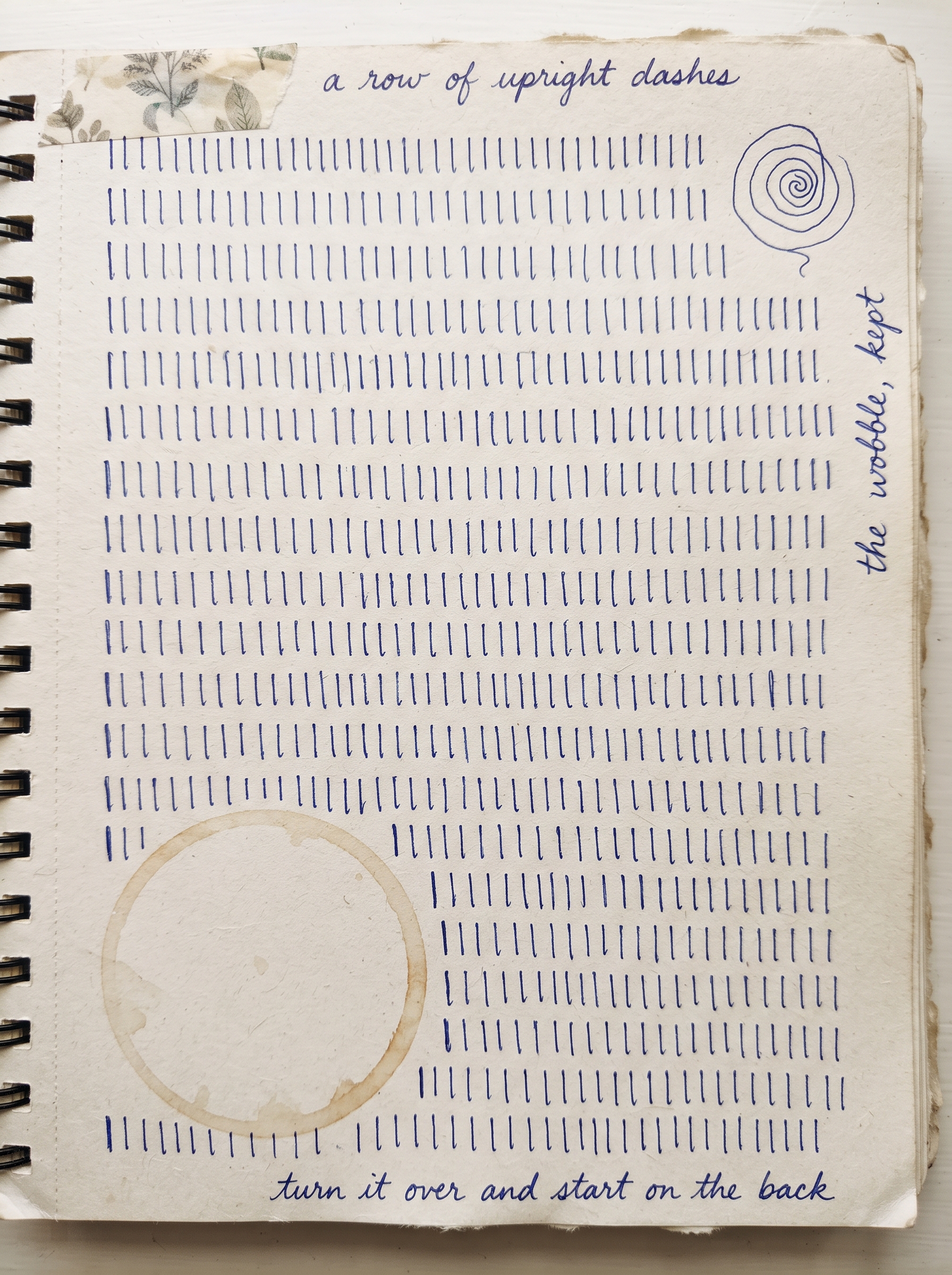 Artist journal page covered in repeated dashes and spirals with handwritten notes