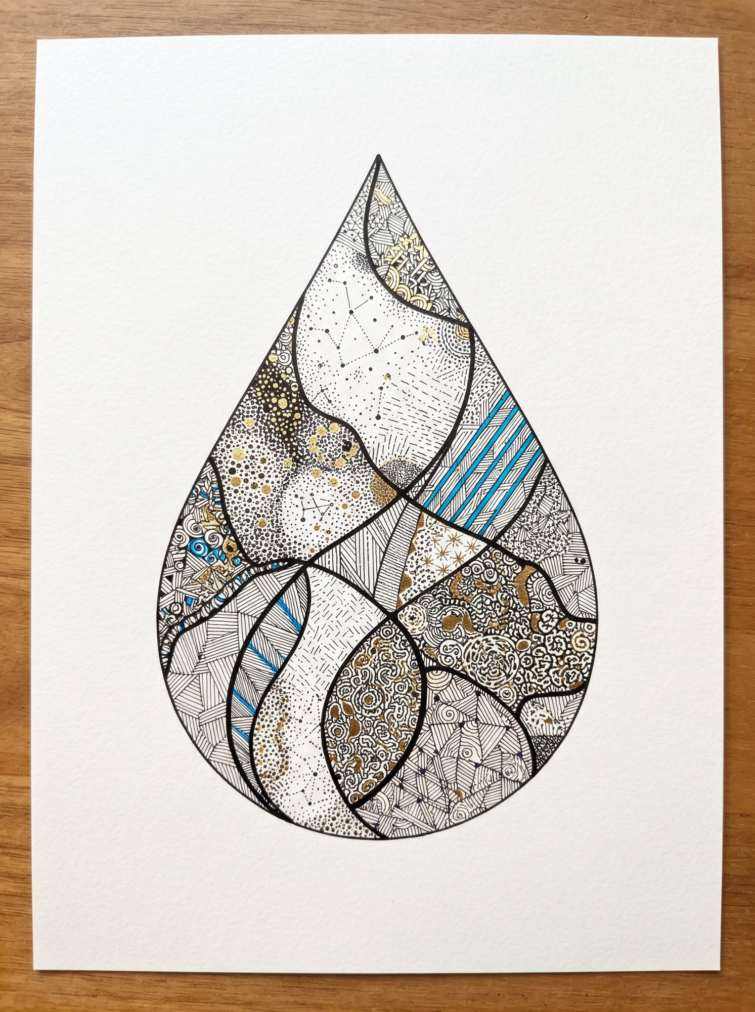 Teardrop shape filled with meditative dot and line zen doodle patterns