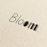 Faux calligraphy: the word Bloom with its downstrokes half thickened and half still outlined