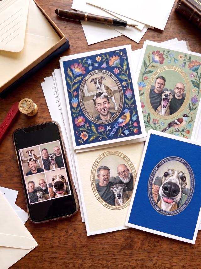 Four printed portrait cards on a desk: a man with a puppy on his head, two men and their whippet yawning, the same two men older sneezing with the old whippet, and the whippet alone, beside the phone snapshots they came from