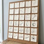 Learn to draw as an adult: 31 small drawings pinned on a cork board, getting more confident each day